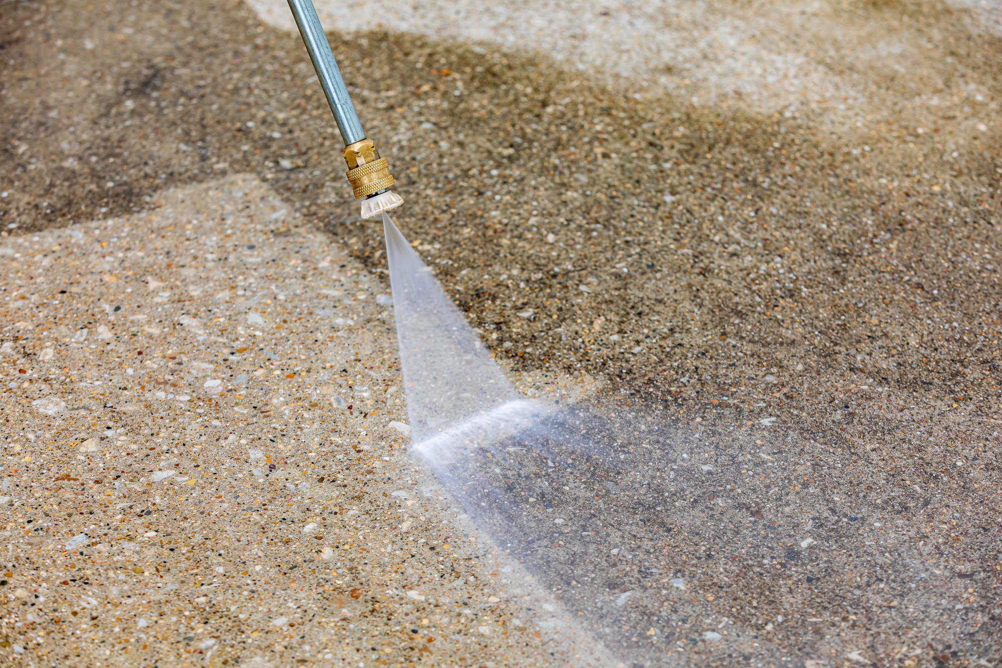 Pressure washing a concrete surface
